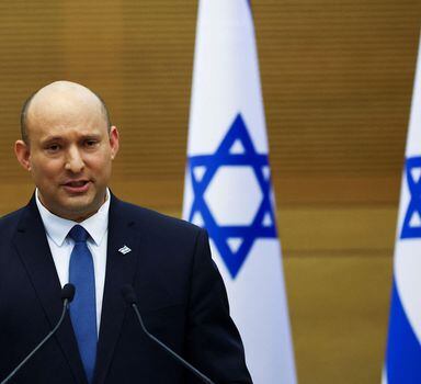Israeli Prime Minister Naftali Bennett speaks next to Foreign Minister Yair Lapid (not pictured) as they give a statement at the Knesset, Israel's parliament, in Jerusalem, June 20, 2022. REUTERS/Ronen Zvulun