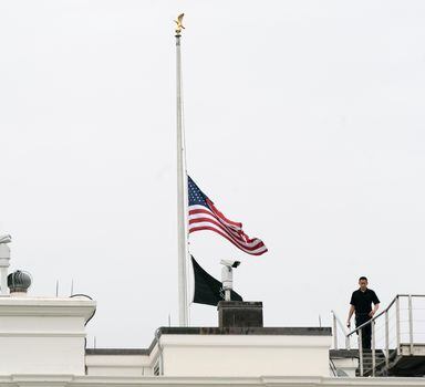 An American flag flies at half-staff at the White House, Tuesday, May 24, 2022, in Washington, to honor the victims of the mass shooting at Robb Elementary School in Uvalde, Texas. (AP Photo/Manuel Balce Ceneta)