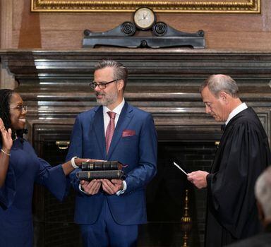 Judge Ketanji Brown Jackson takes her constitutional oath of office as an Associate Justice of the U.S. Supreme Court administered by Chief Justice John Roberts as Jackson’s husband Patrick Jackson holds the Bible in a handout image provided by the U.S. Supreme Court from ceremonies held at the Supreme Court building in Washington, U.S., June 30, 2022. Fred Schilling/Collection of the Supreme Court of the United States/Handout via Reuters EDITORIAL USE ONLY. NO COMMERCIAL OR ADVERTISING SALES. THIS IMAGE HAS BEEN SUPPLIED BY A THIRD PARTY. 