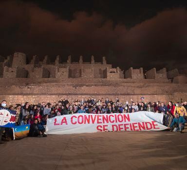 Members of the Constitutional Convention pose for a picture during the official presentation of the draft they made of the new constitution, at the Ruinas de Huanchaca National Monument in Antofagasta, northern Chile, on May 16, 2022. - Chileans will vote in a mandatory referendum on September 4 to approve or reject the new constitution to replace the one enacted in 1980 by the regime of dictator Augusto Pinochet. (Photo by Cristian RUDOLFFI / AFP)