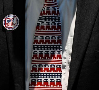 An attendee wears a tie with the Republican Party's symbol while waiting for results at the primary election watch party for Republican U.S. Senate candidate J.D. Vance in Cincinnati, Ohio, U.S. May 3, 2022. REUTERS/Gaelen Morse