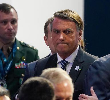 Brazil President Jair Bolsonaro, right, waits for the opening plenary session at the Summit of the Americas, Thursday, June 9, 2022, in Los Angeles. (AP Photo/Marcio Jose Sanchez)