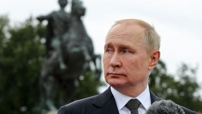 Russian President Vladimir Putin delivers his speech standing in front of the equestrian statue of Peter the Great, prior to the military parade during Navy Day celebrations, on the Neva River, in St.Petersburg, Russia, Sunday, July 31, 2022. (Mikhail Klimentyev, Sputnik, Kremlin Pool Photo via AP)
