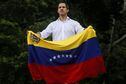 (FILES) In this file photo taken on November 16, 2019, Venezuelan opposition leader and self-proclaimed acting president Juan Guaido displays a national flag during a gathering in front of the Bolivian embassy in Caracas. - Venezuela's main opposition on May 16, 2022, announced primaries in 2023 to elect a single candidate to stand against incumbent Nicolas Maduro in the country's next presidential election. The opposition last held primaries in 2012 when candidate Henrique Capriles romped to victory before he was beaten by the late Hugo Chavez in the presidential election. (Photo by Cristian HERNANDEZ / AFP)