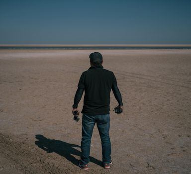 Moises, with the Baja California International Liaison Unit, stands on a beach in the village of San Felipe, Mexico, while searching in October for a fugitive American couple. The International Liaison Unit is also known as the Gringo Hunters. The unit members' last names are being withheld so they can continue to work undercover. MUST CREDIT: Photo for The Washington Post by Luis Antonio Rojas.