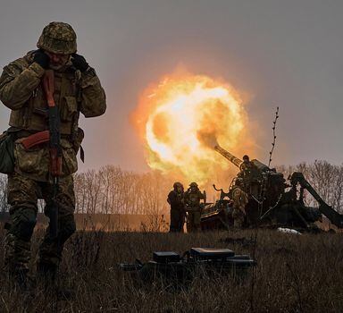FILE - Ukrainian soldiers fire a Pion artillery system at Russian positions near Bakhmut, Donetsk region, Ukraine, Dec. 16, 2022. (AP Photo/LIBKOS, File)