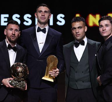 Inter Miami CF's Argentine forward Lionel Messi (L) poses with his trophy next to Aston Villa's Argentine goalkeeper Emiliano Martinez (2L), Inter Milan's Argentine forward Lautaro Martinez (2R) and Manchester City's Argentine forward Julian Alvarez (R) during the 2023 Ballon d'Or France Football award ceremony at the Theatre du Chatelet in Paris on October 30, 2023. (Photo by FRANCK FIFE / AFP)