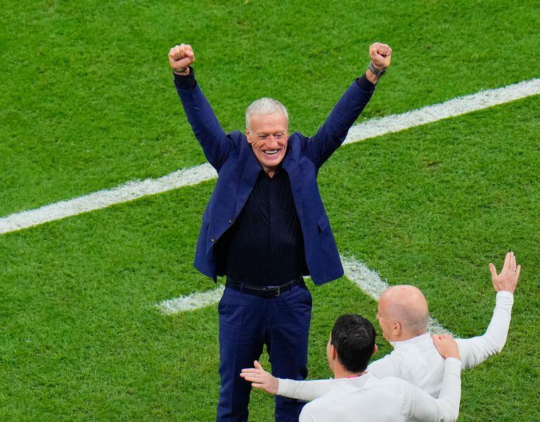 France's head coach Didier Deschamps celebrates after the World Cup semifinal soccer match between France and Morocco at the Al Bayt Stadium in Al Khor, Qatar, Wednesday, Dec. 14, 2022. (AP Photo/Hassan Ammar)
