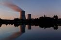 FILE PHOTO: Steam rises from a cooling tower of the Electricite de France (EDF) nuclear power station in Civaux, France, October 8, 2021. Picture taken with long exposure. REUTERS/Stephane Mahe/File Photo