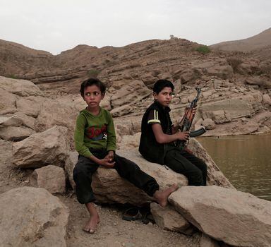 FILE - A 17 year-old boy holds his weapon at the High dam in Marib, Yemen, July 30, 2018. emenâ€™s Houthi rebels continue to recruit children into their military ranks to fight in the countryâ€™s civil war, despite an agreement with the U.N. in April 2022, to halt the practice. Two Houthi officials acknowledged to the Associated Press that the rebels have recruited several hundred children, some as young as 10, in the past two months. (AP Photo/Nariman El-Mofty, File)