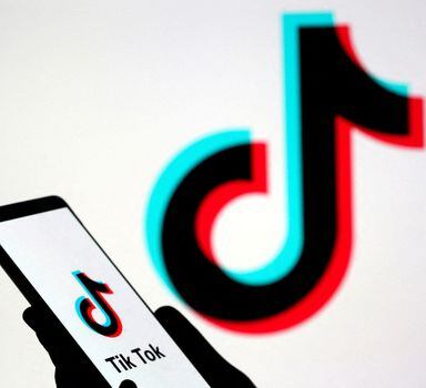 FILE PHOTO: A person holds a smartphone with Tik Tok logo displayed in this picture illustration taken November 7, 2019. Picture taken November 7, 2019. REUTERS/Dado Ruvic/Illustration/File Photo