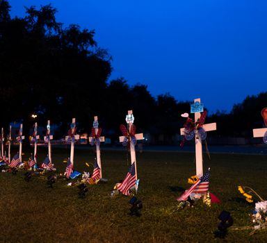 21 crosses stand along the Main Street in Uvalde, Texas, Wednesday, June 1, 2022, to honor the victims killed in last week's elementary school shooting that killed 19 students and two teachers. (AP Photo/Jae C. Hong)