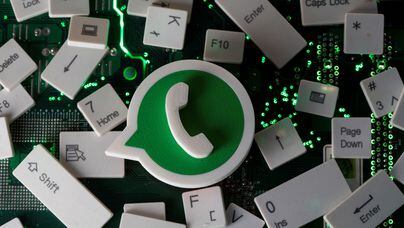 A 3D printed Whatsapp logo and keyboard buttons are placed on a computer motherboard in this illustration taken January 21, 2021. REUTERS/Dado Ruvic/Illustration