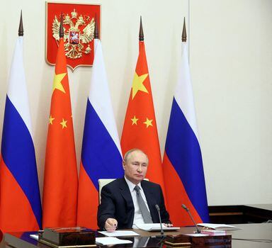 Russian President Vladimir Putin holds talks with Chinese President Xi Jinping via a video link at his residence outside Moscow, Russia December 15, 2021. Sputnik/Mikhail Metzel/Pool via REUTERS ATTENTION EDITORS - THIS IMAGE WAS PROVIDED BY A THIRD PARTY.