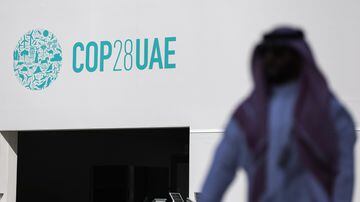 Dubai (United Arab Emirates), 29/11/2023.- A man walks in front of the COP28 logo at Expo City Dubai, the venue of the 2023 United Nations Climate Change Conference (COP28), in Dubai, UAE, 29 November 2023. The 2023 United Nations Climate Change Conference (COP28), runs from 30 November to 12 December, and is expected to host one of the largest number of participants in the annual global climate conference as over 70,000 estimated attendees, including the member states of the UN Framework Convention on Climate Change (UNFCCC), business leaders, young people, climate scientists, Indigenous Peoples and other relevant stakeholders will attend. EFE/EPA/ALI HAIDER
