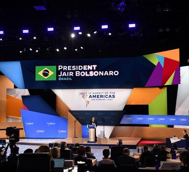 The President of Brazil, Jair Bolsonaro, speaks during plenary session of the 9th Summit of the Americas in Los Angeles, California, June 10, 2022. - US Secretary of State Antony Blinken is ate right seated. (Photo by Patrick T. FALLON / AFP)