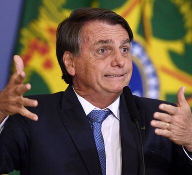 Brazilian President Jair Bolsonaro delivers a speech during a meeting called "Brazil for Life and Family" and promoted by an anti-abortion movement, at Planalto Palace in Brasilia, on June 7, 2022. - Bolsonaro in his speech attacked the Supreme Court, the Electoral Justice and its judges. (Photo by EVARISTO SA / AFP)