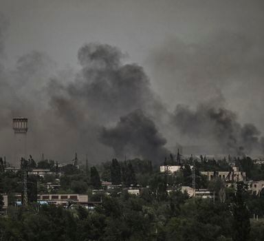 Smoke and dirt rise in the city of Severodonetsk during fighting between Ukrainian and Russian troops at the eastern Ukrainian region of Donbas on June 2, 2022. (Photo by ARIS MESSINIS / AFP)