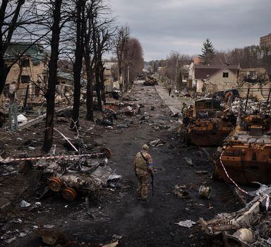 FILE - A Ukrainian serviceman walks amid destroyed Russian tanks in Bucha, on the outskirts of Kyiv, Ukraine, April 6, 2022. Russia is bracing up for a massive new offensive in eastern Ukraine, hoping to reverse its fortunes on the battlefield after a catastrophic start of the invasion. (AP Photo/Felipe Dana, File)