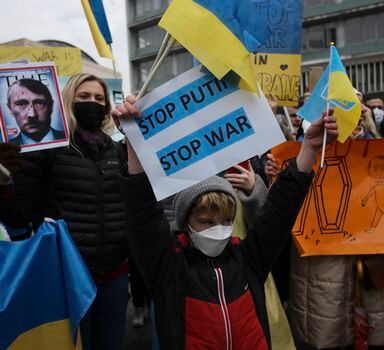 People including Ukrainians protest against Russia's invasion of Ukraine, in Ankara, Turkey, Saturday, Feb. 26, 2022. Russian troops stormed toward Ukraine's capital Saturday, and street fighting broke out as city officials urged residents to take shelter. (AP Photo/Burhan Ozbilici)