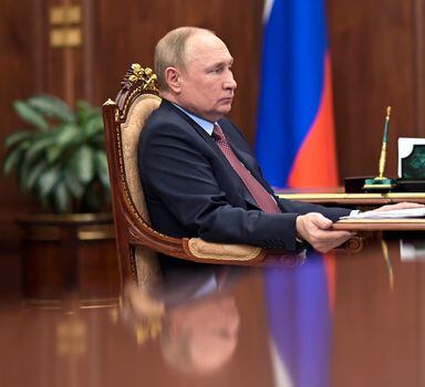 Russian President Vladimir Putin attends a meeting in the Kremlin in Moscow, Russia, Wednesday, April 6, 2022. ()