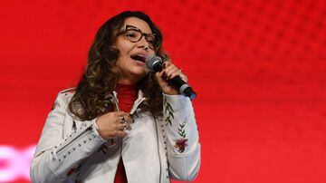 Rosangela "Janja" da Silva, wife of Brazilian presidential pre-candidate for the leftist Workers Party (PT) and former President (2003-2010) Luiz Inacio Lula da Silva, sings during a political rally in Brasilia, on July 12, 2022. (Photo by EVARISTO SA / AFP)