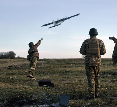 FILE - Ukrainian soldiers launch a drone at Russian positions near Bakhmut, Donetsk region, Ukraine, Thursday, Dec. 15, 2022. (AP Photo/LIBKOS, File)