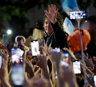 Javier Milei, Liberty Advances coalition presidential candidate, right, greets supporters during his closing campaign rally in Cordoba, Argentina, Thursday, Nov. 16, 2023. Milei will face Economy Minister Sergio Massa, the ruling party's candidate, in a runoff election on Nov. 19. (AP Photo/Nicolas Aguilera)