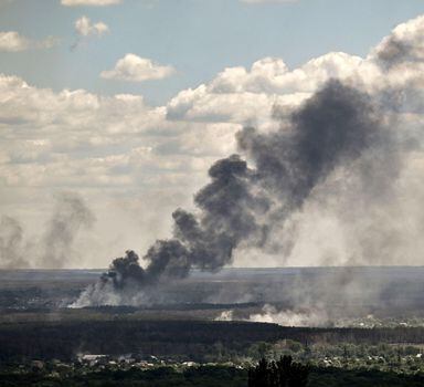 Smoke and dirt rise from shelling in the city of Severodonetsk during fight between Ukrainian and Russian troops in the eastern Ukrainian region of Donbas on June 7, 2022. (Photo by ARIS MESSINIS / AFP)