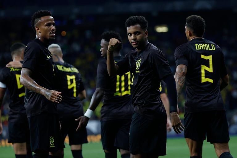 Brazil's Rodrygo, centre, celebrates after scoring his side's second goal during an international friendly soccer match between Brazil and Guinea at the RCDE Stadium in Barcelona, Spain, Saturday, June 17, 2023. (AP Photo/Joan Monfort)