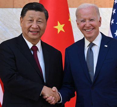 (FILES) US President Joe Biden (R) and China's President Xi Jinping (L) shake hands as they meet on the sidelines of the G20 Summit in Nusa Dua on the Indonesian resort island of Bali on November 14, 2022. Chinese President Xi Jinping arrived in San Francisco on November 14, 2023, a day ahead of his highly anticipated meeting with American counterpart Joe Biden. Xi last traveled to the United States six years ago, and is due for lengthy talks with Biden in their first in-person meeting in a year. The two presidents are meeting on the sidelines of the Asia-Pacific Economic Cooperation (APEC) summit as both countries seek to stabilize ties. (Photo by SAUL LOEB / AFP)