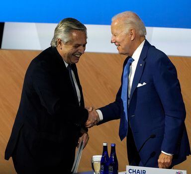 Argentina President Alberto Fernandez, left, shakes hands with United States President Joe Biden during the opening plenary session at the Summit of the Americas Thursday, June 9, 2022, in Los Angeles. (AP Photo/Marcio Jose Sanchez)