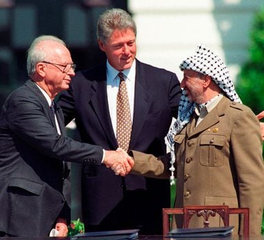 FILE - Israeli Prime Minister Yitzhak Rabin, left, and Palestinian leader Yasser Arafat shake hands marking the signing of the peace accord between Israel and the Palestinians, in Washington, Sept. 13, 1993. Israel's foreign minister told the Norwegian foreign minister Wednesday, Sept. 13, 2023 that Israel rejects “external dictates” on its handling of the Israeli-Palestinian conflict, according to a statement from his office. Foreign Minister Eli Cohen's statement comes on the 30th anniversary of the Oslo Accords, a peace agreement between Israel and Palestinian leaders which many view as the region's last gasp at peace. (AP Photo/Ron Edmonds, File)