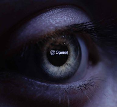 This illustration photograph taken with a macro lens shows an 'OpenAI' logo reverse projected onto a human eye at a studio in Paris on June 6, 2023. ChatGPT is a conversational artificial intelligence software application developed by OpenAI. (Photo by JOEL SAGET / AFP)