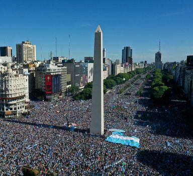 Argentine soccer fans celebrate their team's World Cup victory over France, in Buenos Aires, Argentina, Sunday, Dec. 18, 2022. (AP Photo/Gustavo Garello)