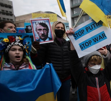 People including Ukrainians protest against Russia's invasion of Ukraine, in Ankara, Turkey, Saturday, Feb. 26, 2022. Russian troops stormed toward Ukraine's capital Saturday, and street fighting broke out as city officials urged residents to take shelter. (AP Photo/Burhan Ozbilici)