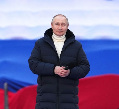 Russian President Vladimir Putin attends a concert marking the eighth anniversary of Russia's annexation of Crimea at Luzhniki Stadium in Moscow, Russia March 18, 2022. RIA Novosti Host Photo Agency/Alexander Vilf via REUTERS