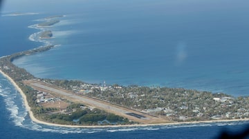 FILE - Funafuti, the main island of the nation state of Tuvalu, is photographed from a Royal New Zealand airforce C130 aircraft as it approaches the tiny South Pacific nation. On Friday, Jan 26, 2024, the small Pacific island of Tuvalu head to the polls to select representatives for its 16-seat parliament. (AP Photo/Alastair Grant, File)