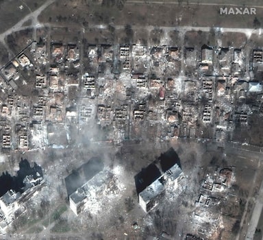 TOPSHOT - This satellite image distributed by Maxar Technologies shows destroyed apartment buildings and houses east of Mariupol, Ukraine on March 29, 2022. - Russia was accused before the UN Security Council on Tuesday of having caused a "global food crisis" and putting people at risk of "famine" by starting the war in Ukraine, which serves as a breadbasket for Europe.
One Russian strike on a theatre-turned-shelter in Mariupol is feared to have killed 300 people. (Photo by Satellite image ©2022 Maxar Technologies / AFP) / RESTRICTED TO EDITORIAL USE - MANDATORY CREDIT "AFP PHOTO / Satellite image ©2022 Maxar Technologies " - NO MARKETING - NO ADVERTISING CAMPAIGNS - DISTRIBUTED AS A SERVICE TO CLIENTS - THE WATERMARK MAY NOT BE REMOVED/CROPPED