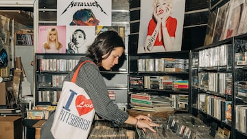 Veronica Fuentes looks through CDs at Record Runner in New York City. (MUST CREDIT: Photo for The Washington Post by Jeenah Moon)