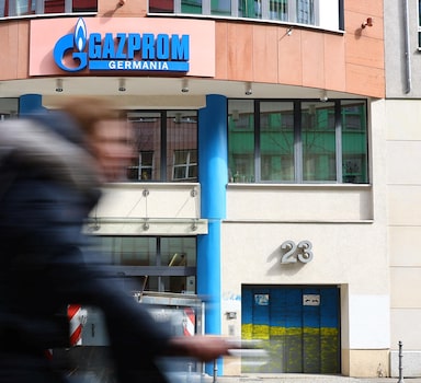 A cyclist passes the headquarters of Gazprom Germania, in Berlin, Germany April 1, 2022. REUTERS/Fabrizio Bensch
