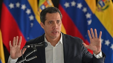 (FILES) Former Venezuelan National Assembly president and opposition leader Juan Guaido speaks during a press conference in Caracas, on June 14, 2022. The Venezuelan prosecutor's office said it had issued an arrest warrant for opposition leader Juan Guaido and would ask for Interpol's help in his apprehension, on October 5, 2023. Prosecutors were appointed "to issue an arrest warrant against him and to request a Red Notice from Interpol so that he pays for his crimes," Prosecutor Tarek William Saab said. Living in exile in the United States, Guaido was accused of treason, usurpation of functions, money laundering and association with a view to committing a crime, the official said. (Photo by Federico PARRA / AFP)