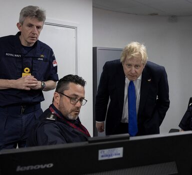 British Prime Minister Boris Johnson visits the command room at the 'Maritime rescue coordination centre' in Dover, Britain, April 14, 2022. Dan Kitwood/Pool via REUTERS