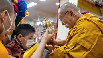 An undated photo provided by The Dalai Lama's office shows the Dalai Lama introducing A. Altannar, the eight-year-old Mongolian boy who has been selected as one of Tibetan Buddhism’s most venerated figures, at a ceremony in front of worshipers in March, 2023. To leaders of the faith, the boy’s emergence is vital to ensuring the continuity of Tibetan Buddhism in Mongolia, a country that is still recovering from decades of sometimes violent religious repression under its former socialist rulers. (The Dalai Lama's office via The New York Times)  — NO SALES; FOR EDITORIAL USE ONLY WITH NYT STORY SLUGGED TIBET-BUDDHISM-BOY BY DAVID PIERSON FOR OCT. 4, 2023. ALL OTHER USE PROHIBITED. —
