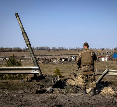 FILE Ñ A Ukrainian soldier looks at the remnants of a Russian T90 tank that was said to have been destroyed using an American-made Javelin missile at a frontline position in the northern region of Kyiv, Ukraine, on March 25, 2022. Washington and its allies are scouring Central Europe and the world to get Ukraine the weapons it needs for the next phase of the war. (Ivor Prickett/The New York Times)