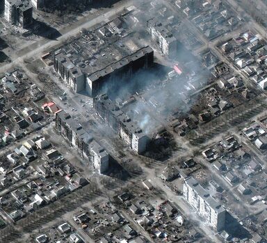 A satellite image shows burning and destroyed apartment buildings, in Mariupol, Ukraine, March 22, 2022. Satellite image ©2022 Maxar Technologies/Handout via REUTERS ATTENTION EDITORS - THIS IMAGE HAS BEEN SUPPLIED BY A THIRD PARTY. MANDATORY CREDIT. NO RESALES. NO ARCHIVES. DO NOT OBSCURE LOGO.