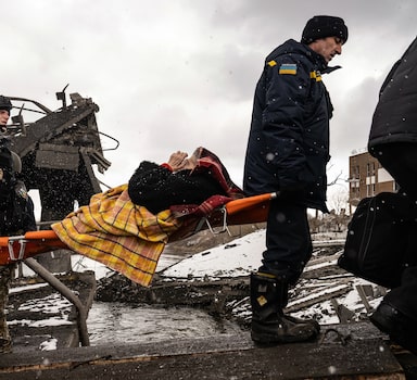 An elderly woman is evacuated from Irpin, Ukraine, near Kyiv, on Tuesday, March 8, 2022. The U.N.relief agency says that the number of people who have fled Ukraine since the Russian invasion began has reached two million. (Lynsey Addario/The New York Times) Ñ NO SALES Ñ 