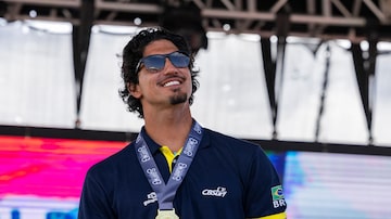 Gabriel Medina from Brazil, celebrates winning the gold medal at the final of the ISA World Surfing Games, a qualifier for the Paris 2024 Olympic Games, at La Marginal beach in Arecibo, Puerto Rico, Sunday, March. 3, 2024. (AP Photo/Alejandro Granadillo)