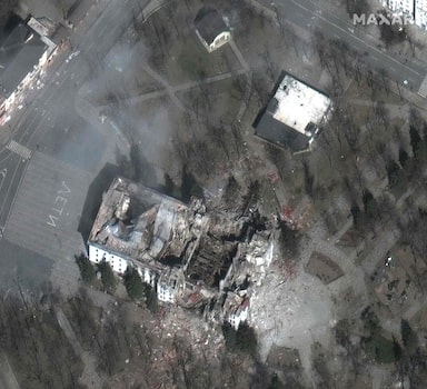 This satellite image distributed by Maxar Technologies on March 29, 2022 shows a close up of the extensive damage to the Mariupol theater and nearby buildings in Mariupol, Ukraine on March 29, 2022. Giant white letters on the ground read "children" next to the theatre. - Russia was accused before the UN Security Council on Tuesday of having caused a "global food crisis" and putting people at risk of "famine" by starting the war in Ukraine, which serves as a breadbasket for Europe.
One Russian strike on a theatre-turned-shelter in Mariupol is feared to have killed 300 people. (Photo by Satellite image ©2022 Maxar Technologies / AFP) / RESTRICTED TO EDITORIAL USE - MANDATORY CREDIT "AFP PHOTO / Satellite image ©2022 Maxar Technologies " - NO MARKETING - NO ADVERTISING CAMPAIGNS - DISTRIBUTED AS A SERVICE TO CLIENTS - THE WATERMARK MAY NOT BE REMOVED/CROPPED