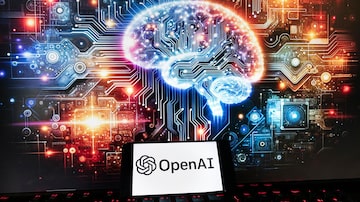 The OpenAI logo is displayed on a cell phone with an image on a computer monitor generated by ChatGPT's Dall-E text-to-image model, Friday, Dec. 8, 2023, in Boston. Europe's yearslong efforts to draw up AI guardrails have been bogged down by the recent emergence of generative AI systems like OpenAI's ChatGPT, which have dazzled the world with their ability to produce human-like work but raised fears about the risks they pose. (AP Photo/Michael Dwyer). Foto: Michael Dwyer/AP Photo  